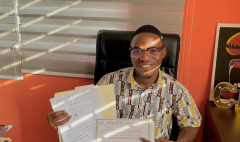 Gonet Academy CEO, Mohammed Kerkulah, displays the newly acquired MOE accreditation