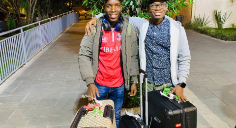 Levi welcomes Marcus upon his arrival in Kigali, Rwanda