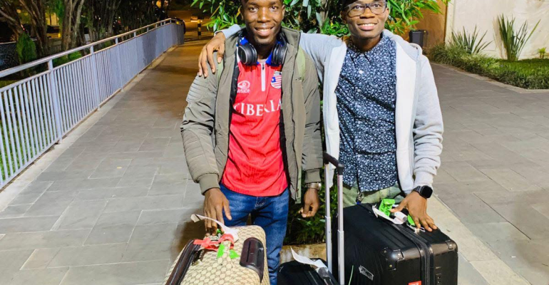 Levi welcomes Marcus upon his arrival in Kigali, Rwanda