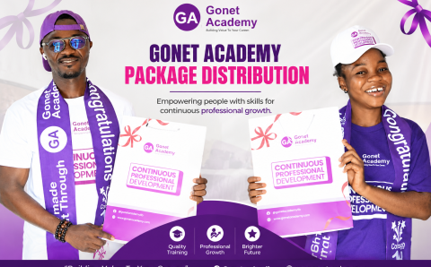 Two students smile as they received their packages on Monday